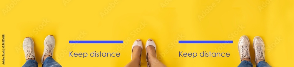 Social distancing concept. Three people keep distance between each other to avoid spreading illness during transmission of COVID-19 outbreak .Yellow modern background for banner. - obrazy, fototapety, plakaty 