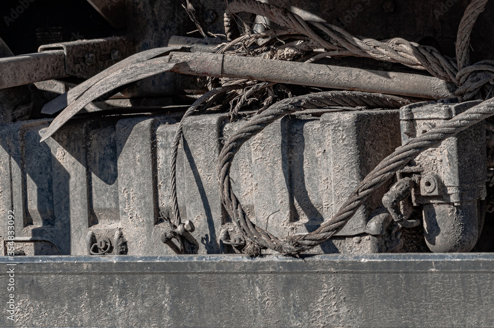 dirty background with a shovel and metal cables.
