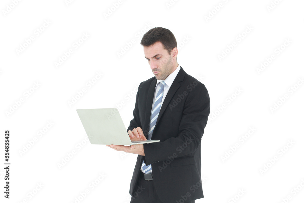 Successful and handsome businessman in a suit smiling with hand holding notebook. He serious in working on a laptop isolated on white background. Copy space Successful and handsome businessman in a suit smiling with hand holding notebook. He serious in working on a laptop isolated on white background. Copy space