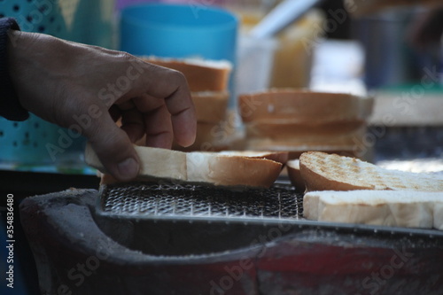 close up of a man cutting bread
