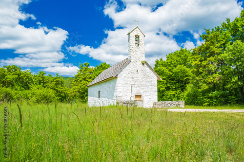 Croatia, region of Lika, beautiful countryside landscape in Otocac with small St Francis church
 photo