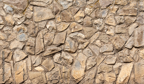Patterned stone texture. The exterior facade of the building.