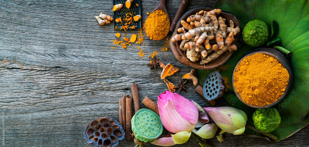 Turmeric powder,Turmeric fresh and ingredient herbs on wooden background Turmeric powder,Turmeric fresh and ingredient herbs on wooden background