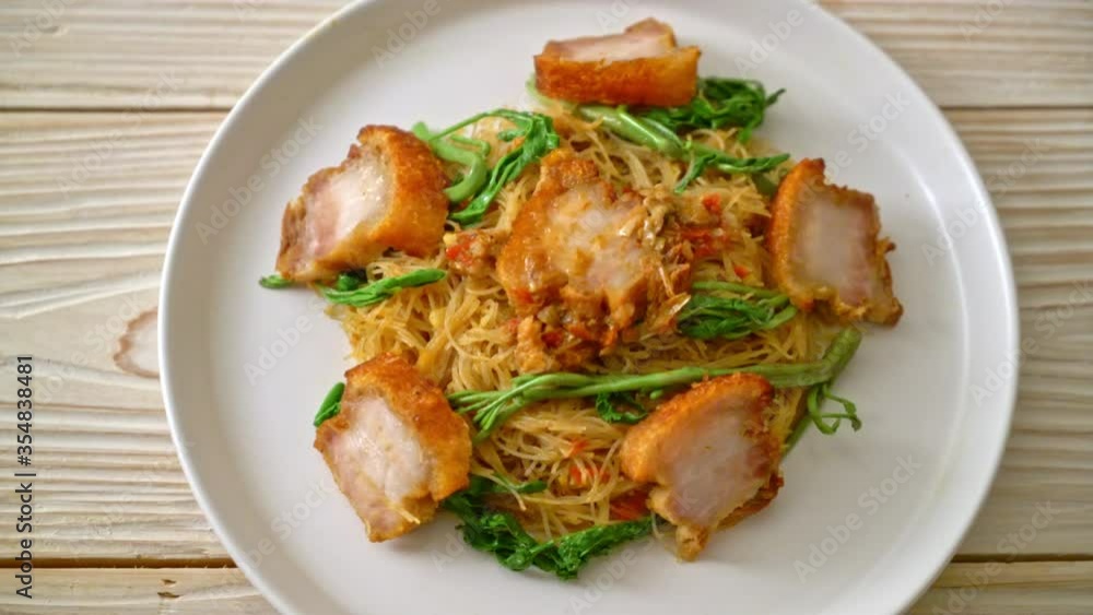 Stir-fried rice vermicelli and water mimosa with crispy pork belly Stir-fried rice vermicelli and water mimosa with crispy pork belly