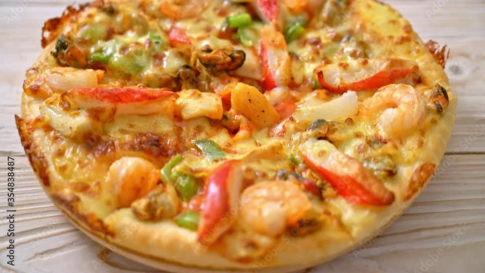 seafood (shrimps, octopus, mussel and crab) pizza on wood tray seafood (shrimps, octopus, mussel and crab) pizza on wood tray