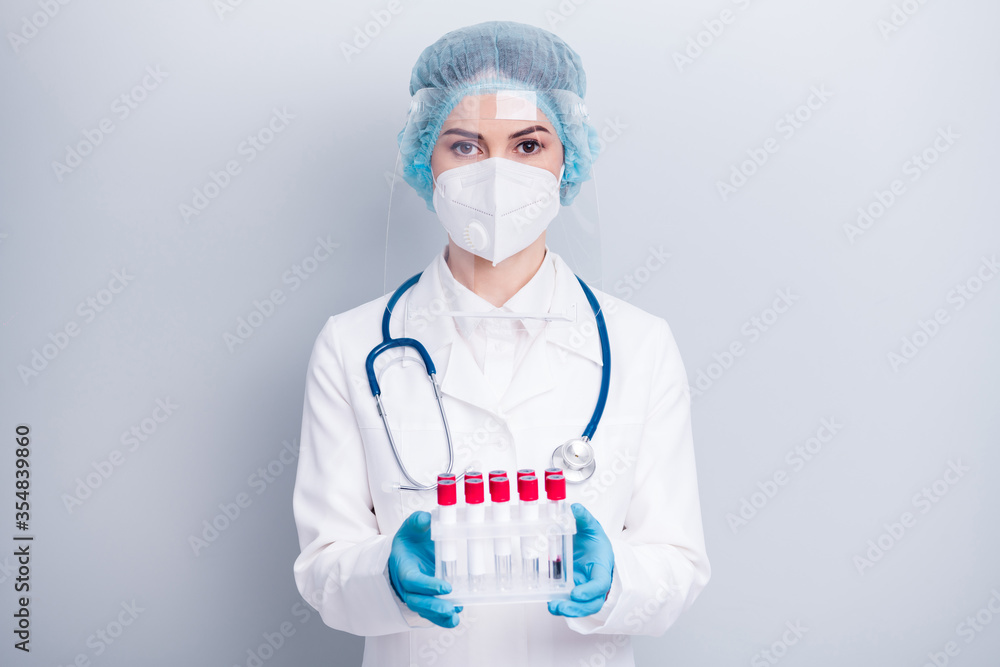 Photo of infection disease doctor nurse hold ready blood probes covid patients laboratory assistant help wear coat mask facial plastic protection shield surgical cap isolated grey background Photo of infection disease doctor nurse hold ready blood probes covid patients laboratory assistant help wear coat mask facial plastic protection shield surgical cap isolated grey background