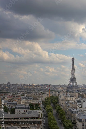 Beautiful, dark, calm photo of the Eiffel Tower taken at sunset from the Arc de Triomphe