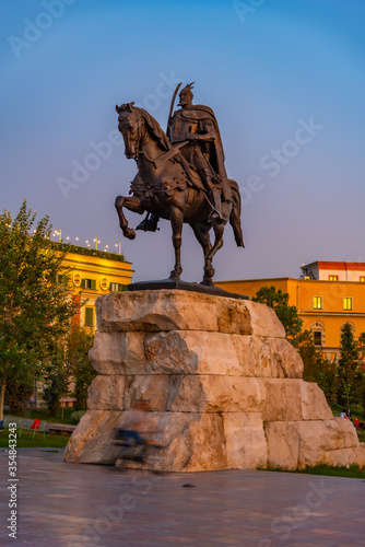 Sunset view of Skanderbeg statue at Tirana, Albania photo