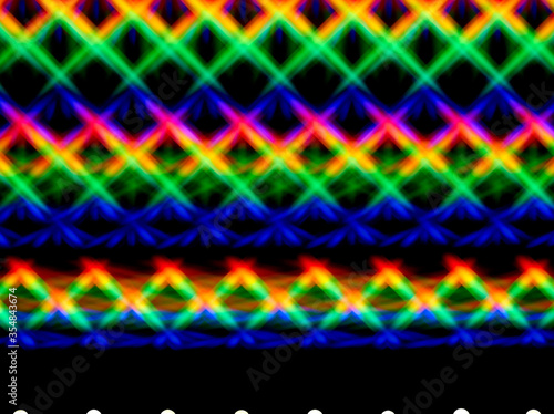 Photo of a diffraction pattern from a double line of LEDs. Image was obtained using a twin  diffraction grating. Beautiful play of light from intersecting brightly colored rainbow light spots