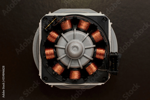 Bilde på lerret Opened electro motor with a copper coil and wire winding