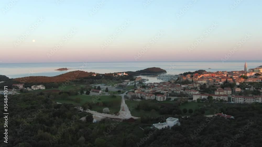 New day starts in a small town in Croatia, Europe. Typical view is complete with historic town, port and sea. New day starts in a small town in Croatia, Europe. Typical view is complete with historic town, port and sea.