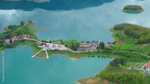 Idyllic Scit Franciscan monastery and Rama lake. Scenic aerial view photo