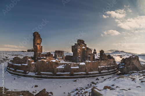 Ani site of historical cities (Ani Harabeleri): first entry into Anatolia, an important trade route Silk Road in the Middle Agesand. Historical Church and temple at sunset in Ani, Kars, Turkey. photo