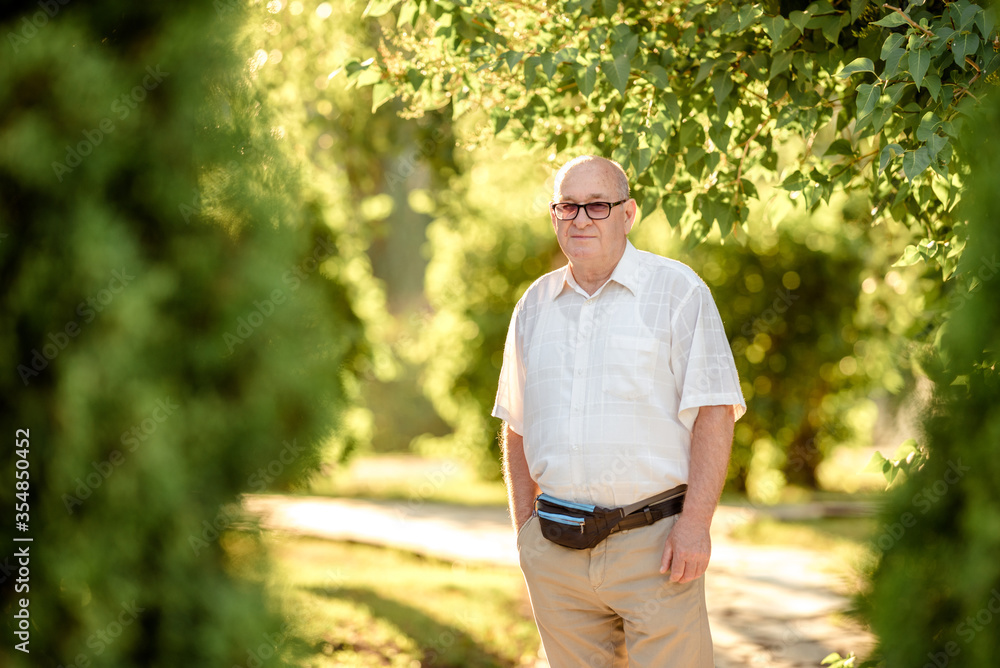 Senior Caucasian man with thoughtful expression outdoor. Senior Caucasian man with thoughtful expression outdoor.