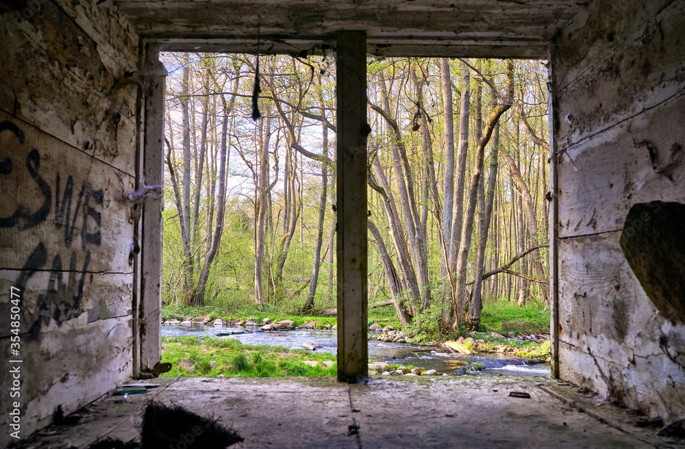 View of the river through an old window. Warnow Durchbruchstal in Mecklenburg-Vorpommern. Germany View of the river through an old window. Warnow Durchbruchstal in Mecklenburg-Vorpommern. Germany