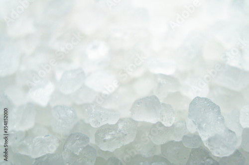 White crystals of coarse salt. Macro photography