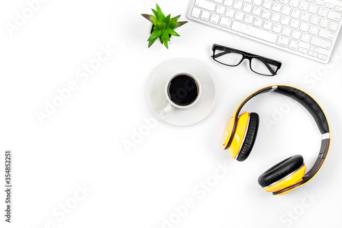 Flat lay webinar concept. headphones near laptop top-down copy space