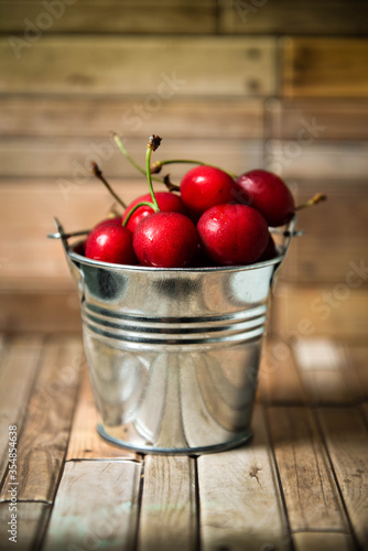 Cherries in aluminum bucket