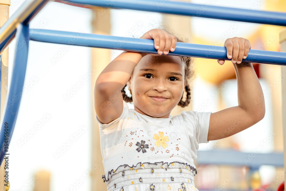Cute African American girl smiling in the street. Cute African American girl smiling in the street.