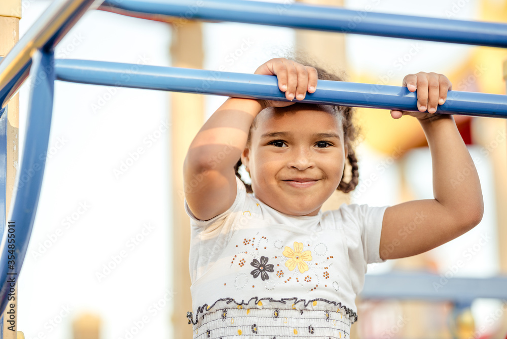 Cute African American girl smiling in the street. Cute African American girl smiling in the street.