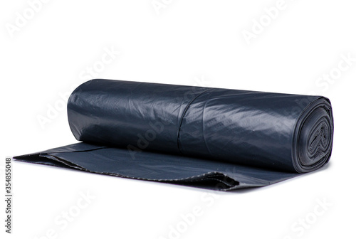 Fototapeta Disposable black trash bag on white background isolation