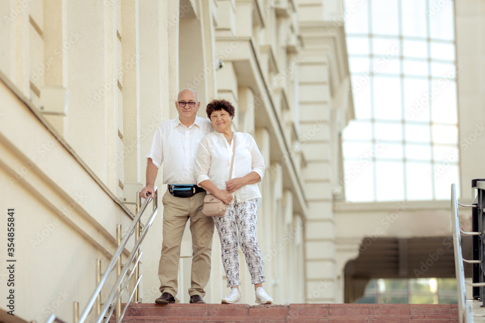Handsome old man and attractive old woman are hugging Handsome old man and attractive old woman are hugging