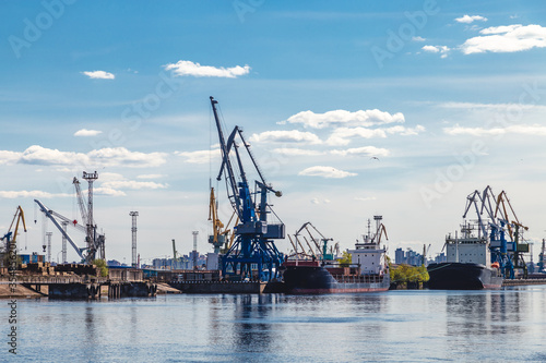 cargo cranes in a river port