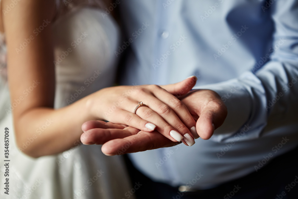 Bride on wedding day holding her father's hands. Concept of relationship between dads and daughters Bride on wedding day holding her father's hands. Concept of relationship between dads and daughters