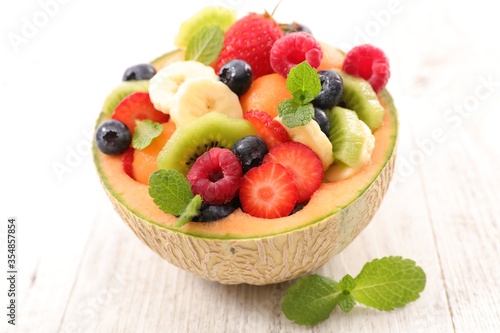 mixed fruit salad with melon, strawberry, blueberry, kiwi