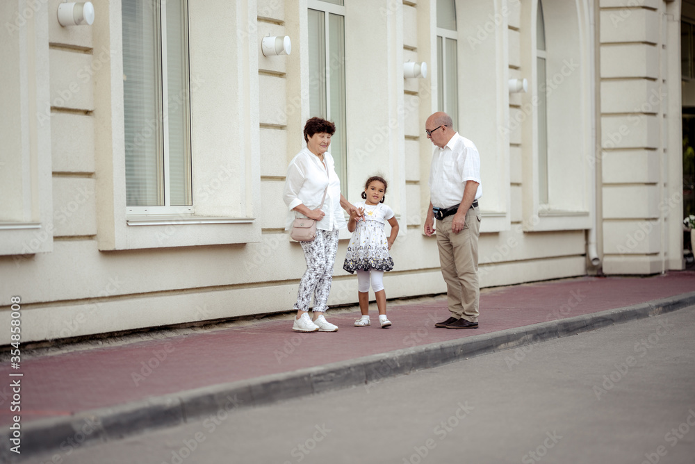 Grandparents playing with their granddaughter Grandparents playing with their granddaughter