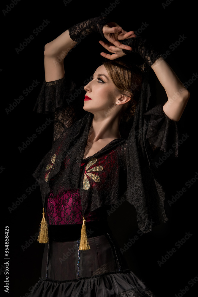 beautiful dancer with hands above head dancing flamenco isolated on black beautiful dancer with hands above head dancing flamenco isolated on black