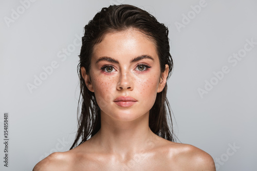 Beauty portrait of an attractive young topless brunette woman