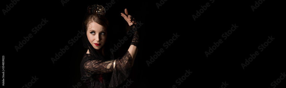 panoramic crop of pretty young dancer dancing flamenco isolated on black panoramic crop of pretty young dancer dancing flamenco isolated on black