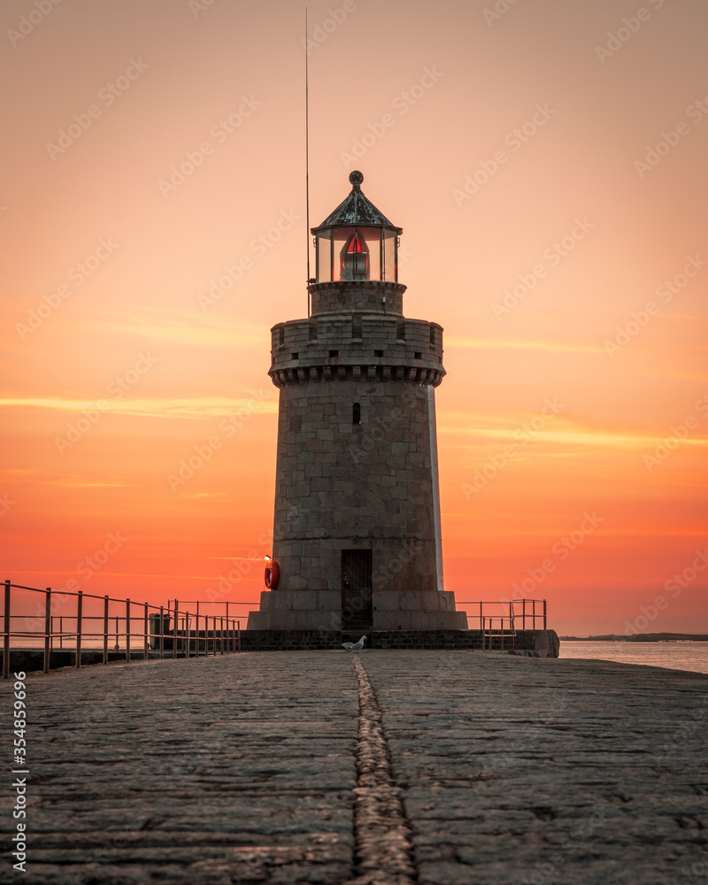 lighthouse at sunrise in Guernsey 