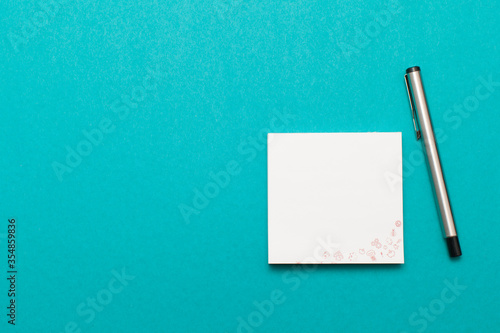 stickers and pencil for notes isolated on aquamarine background