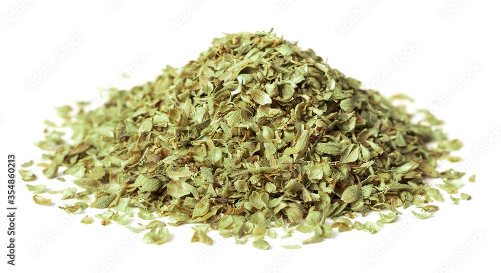 heap of dried oregano flakes isolated on white background heap of dried oregano flakes isolated on white background
