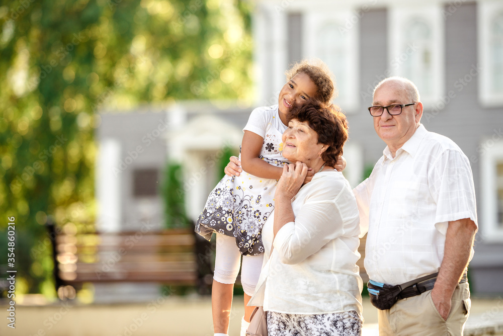 Grandparents playing with their granddaughter Grandparents playing with their granddaughter