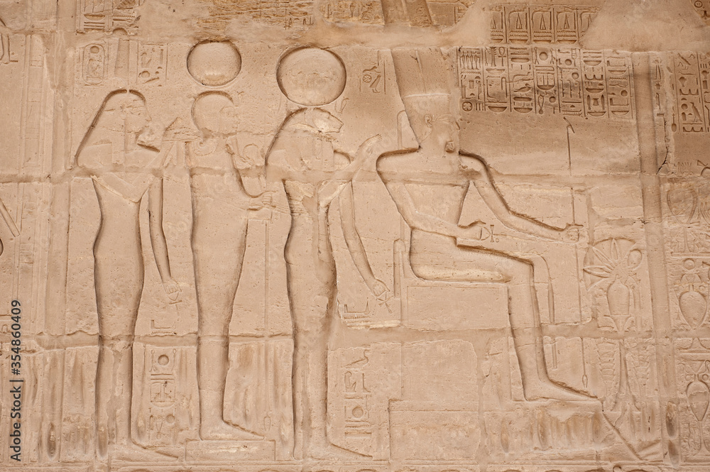 Hieroglyphic carvings on an ancient egyptian temple wall Hieroglyphic carvings on an ancient egyptian temple wall