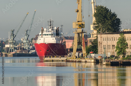 MARITIME TRANSPORT - Merchant vessel moored to the ports wharf