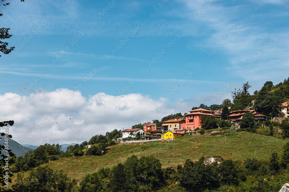 Sunny day in a typical asturian town on the side of a hill in a sunny day