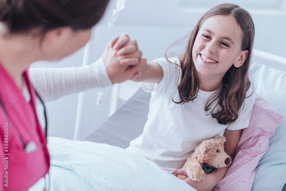 Professional doctor supporting her sick child patient Professional doctor supporting her sick child patient