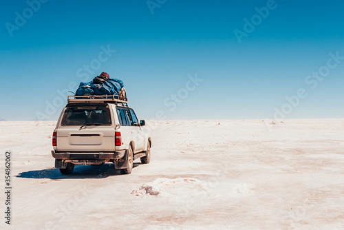 White SUV on the way to the Salar de Uyuni , Bolivia