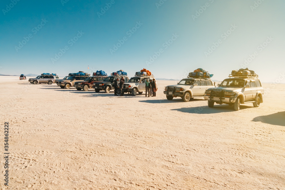 Off-road vehicles parked in line in a rest area in Uyuni