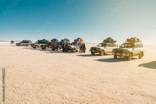 Off-road vehicles parked in line in a rest area in Uyuni