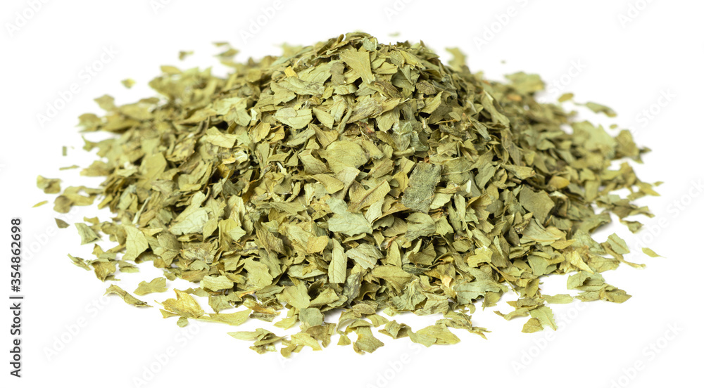 heap of dried parsley flakes isolated on white background heap of dried parsley flakes isolated on white background