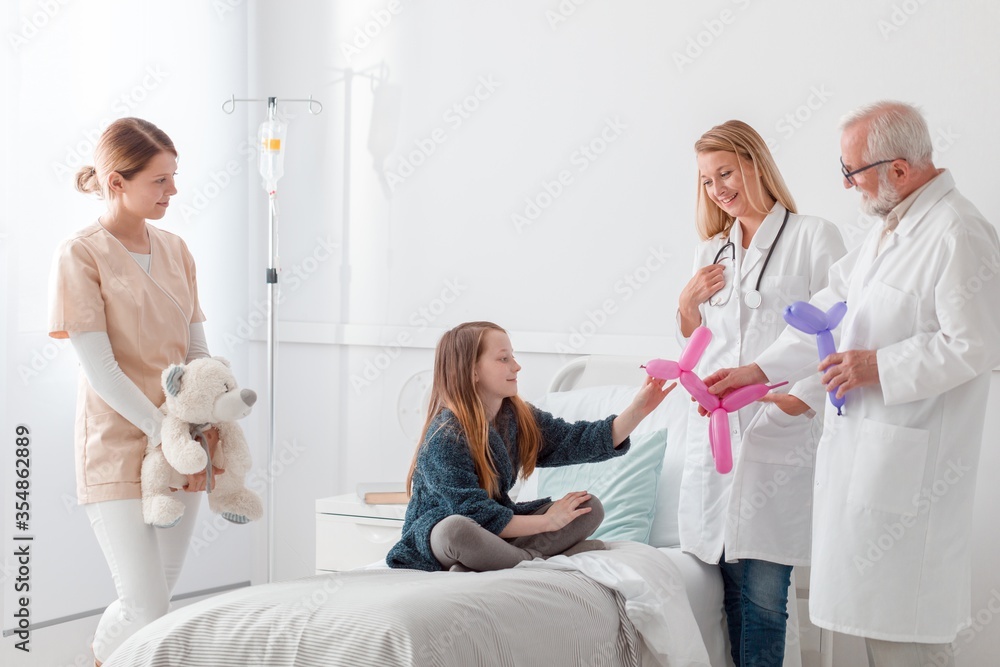 Doctors cheering up the girl Doctors cheering up the girl