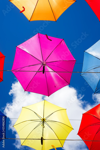 Colorful umbrellas background. Colorful umbrellas in the sky. Street decoration.