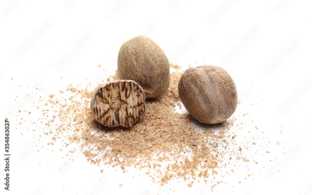 Nutmegs with milled powder isolated on white background Nutmegs with milled powder isolated on white background