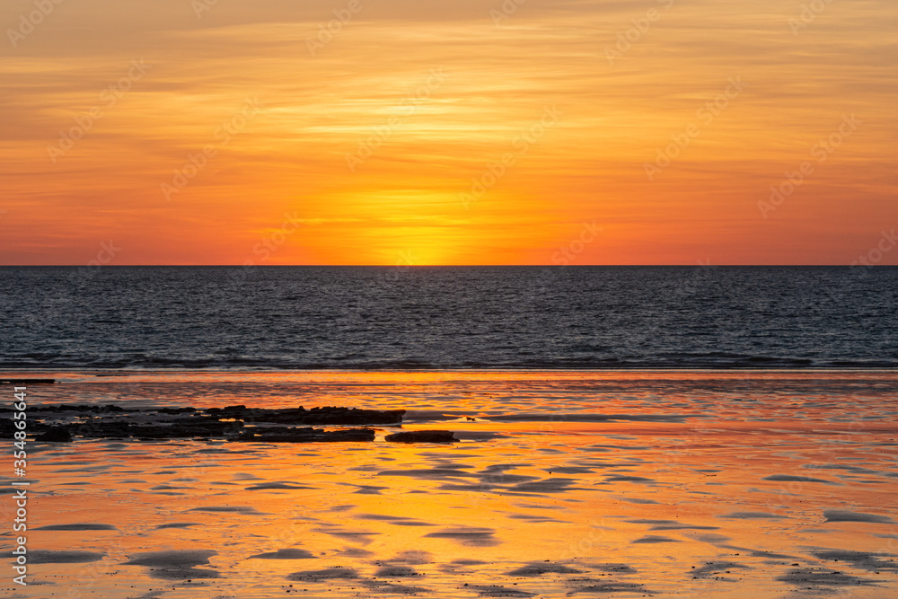 Fototapeta premium Sunset over the ocean at Cable Beach at sunset, Broome, Kimberley, Western Australia, Australia