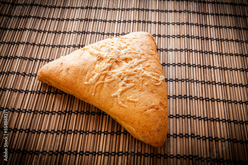 Pan de queso artesano tradicional de tahona sobre fondo de madera photo